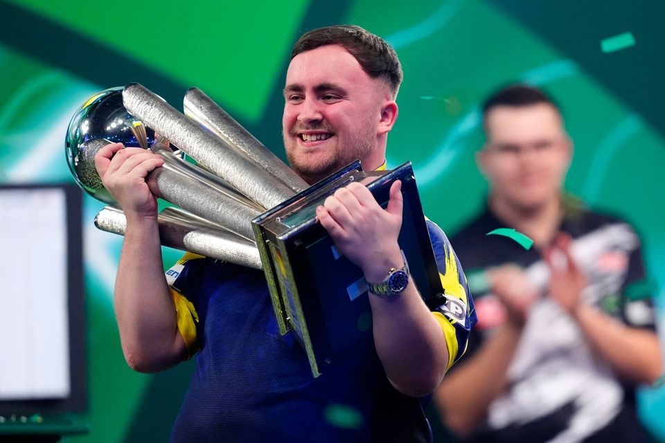 Luke Littler celebrates with the Sid Waddell trophy after victory against Gian van Veen after the final of the World Darts Championship at the Alexandra Palace: John Walton/PA Wire.